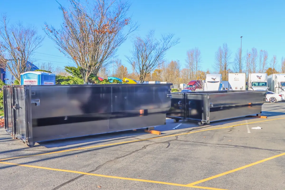Professional dumpster rental service with roll-off container on residential driveway in Flower Mound